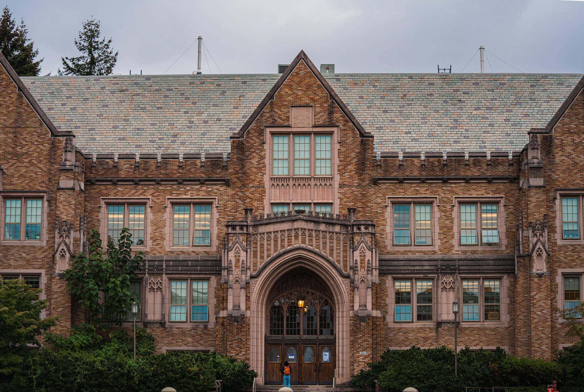 Facade of a historic university building featuring Gothic architecture and ornate stonework.